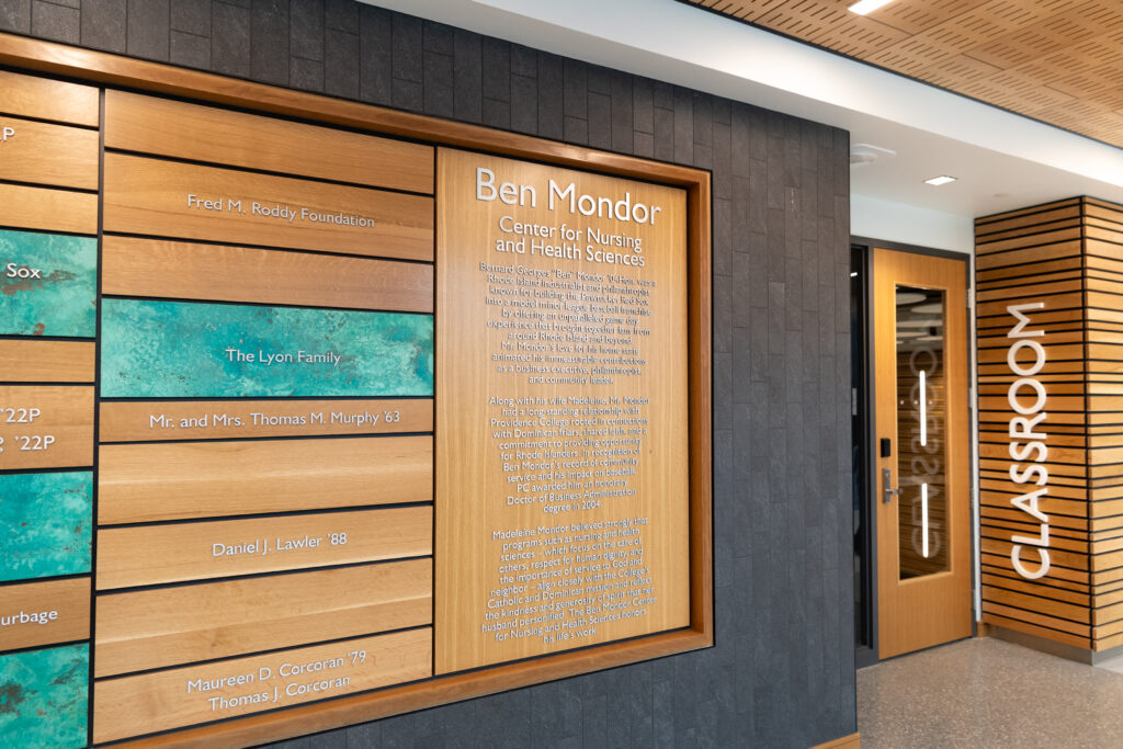 Donor Wall with text about Ben Mondor Center next to classroom entrance